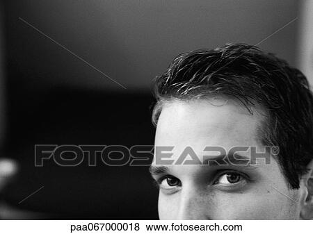 Stock Photo - Partial view of man's face, black and white, close up.. Fotosearch