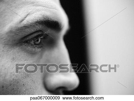 Stock Photo - Partial view of man's face, close up, black and white.. Fotosearch