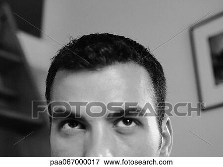 Stock Photo - Partial view of man's face, close-up, black and white.. Fotosearch