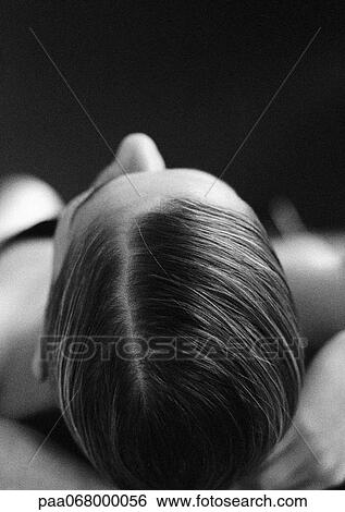 Stock Photograph - Top of woman's head, close-up, black and white.. Fotosearch