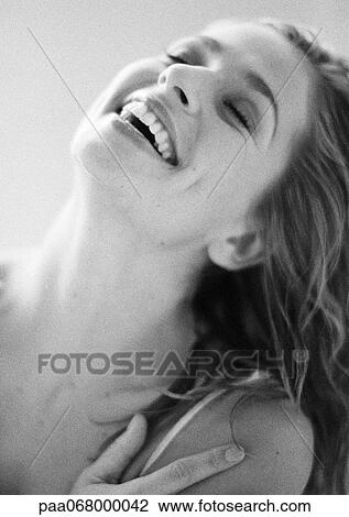 Woman laughing with eyes closed and head back, close-up, portrait, black and white. View Large Photo Image Stock Image - Woman laughing with eyes closed and head back, close-up, portrait, black and white.. Fotosearch