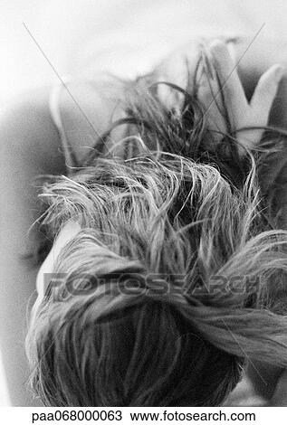 Woman leaning head forward, close-up on head and shoulders, black and white. View Large Photo Image Stock Image - Woman leaning head forward, close-up on head and shoulders, black and white.. Fotosearch