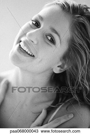 Woman smiling at camera, head tilted back, portrait, close-up, black and white. View Large Photo Image Stock Image - Woman smiling at camera, head tilted back, portrait, close-up, black and white.. Fotosearch