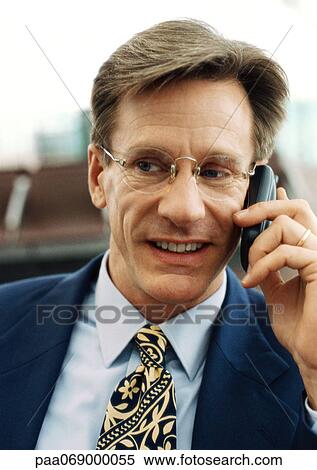 Businessman using cellular phone, front view, close-up, portrait. View Large Photo Image Stock Photography - Businessman using cellular phone, front view, close-up, portrait.. Fotosearch