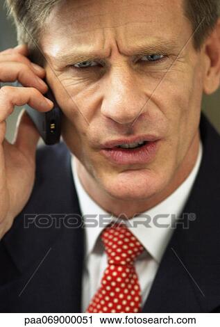 Businessman using cellular phone, close-up portrait. View Large Photo Image Stock Image - Businessman using cellular phone, close-up portrait.. Fotosearch