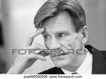 Businessman with fingers on face, looking away, close-up, black and white. View Large Photo Image Stock Photo - Businessman with fingers on face, looking away, close-up, black and white.. Fotosearch