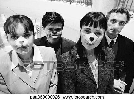 Businessmen and women wearing animal noses, looking at camera View Large Photo Image Stock Photograph - Businessmen and women wearing animal noses, looking at camera. Fotosearch