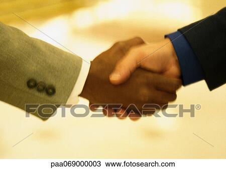 Businessmen shaking hands, blurred close-up. View Large Photo Image Stock Image - Businessmen shaking hands, blurred close-up.. Fotosearch