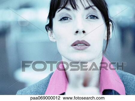 Businesswoman looking and pointing at camera, fingers blurred in foreground, close-up, cool toned. View Large Photo Image Stock Image - Businesswoman looking and pointing at camera, fingers blurred in foreground, close-up, cool toned.. Fotosearch