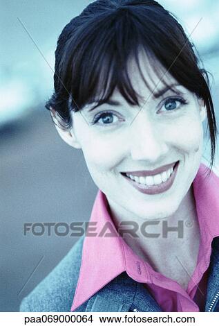 Picture - Businesswoman smiling at camera, close-up, portrait, cool-toned. Fotosearch