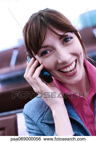 Businesswoman using cellular phone and smiling, close-up, portrait. View Large Photo Image Stock Photograph - Businesswoman using cellular phone and smiling, close-up, portrait.. Fotosearch