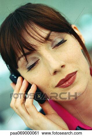 Businesswoman using cellular phone, eyes closed, close-up, portrait. View Large Photo Image Stock Image - Businesswoman using cellular phone, eyes closed, close-up, portrait.. Fotosearch