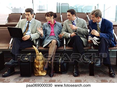 Group of business people sitting in terminal. View Large Photo Image Stock Image - Group of business people sitting in terminal.. Fotosearch