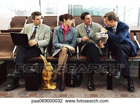Group of business people sitting in terminal. View Large Photo Image Stock Image - Group of business people sitting in terminal.. Fotosearch