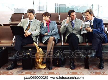 Group of business people sitting in terminal. View Large Photo Image Stock Photo - Group of business people sitting in terminal.. Fotosearch