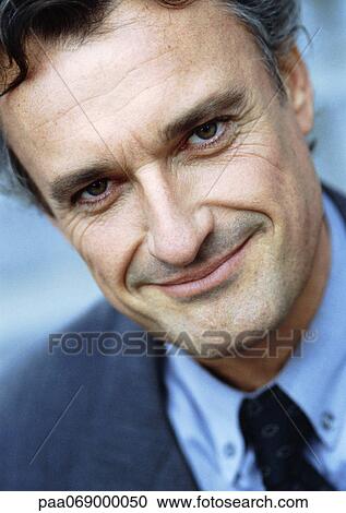Man in business suit looking at camera, portrait, close-up, tilt. View Large Photo Image Stock Image - Man in business suit looking at camera, portrait, close-up, tilt.. Fotosearch