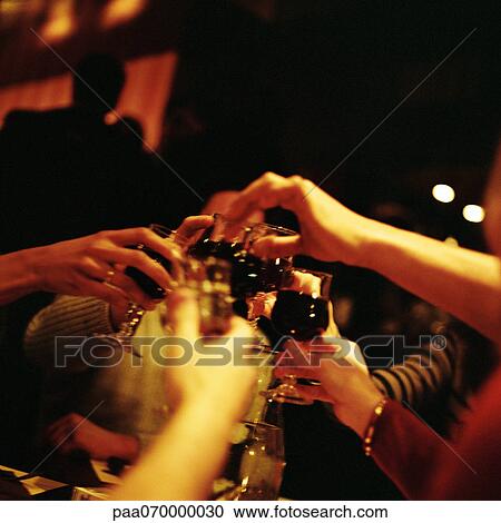 Group of people clinking glasses View Large Photo Image Stock Image - Group of people clinking glasses. Fotosearch