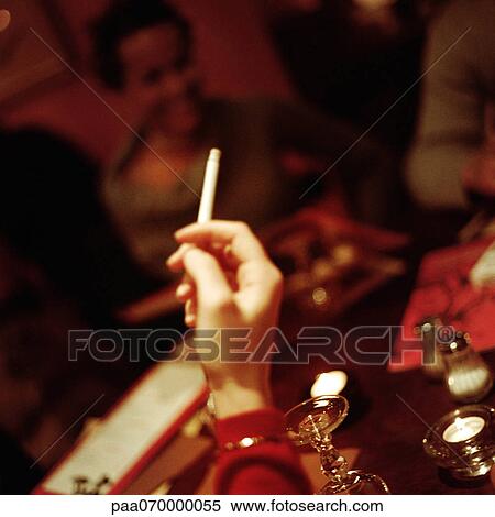 Hand holding cigarette. View Large Photo Image Stock Photography - Hand holding cigarette.. Fotosearch