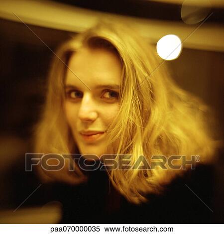 Young woman looking at camera, close-up, portrait. View Large Photo Image Stock Photography - Young woman looking at camera, close-up, portrait.. Fotosearch