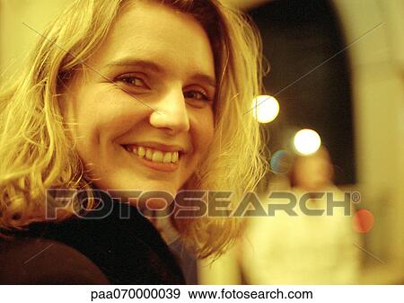 Young woman smiling at camera, portrait. View Large Photo Image Stock Photo - Young woman smiling at camera, portrait.. Fotosearch