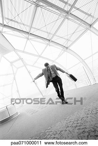 Businessman dancing with briefcase in hand, b&w. View Large Photo Image Stock Image - Businessman dancing with briefcase in hand, b&w.. Fotosearch