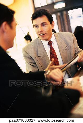 Businessmen discussing View Large Photo Image Stock Photo - Businessmen discussing . Fotosearch