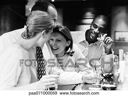 Group of business people socializing at bar, b&w. View Large Photo Image Stock Photo - Group of business people socializing at bar, b&w.. Fotosearch