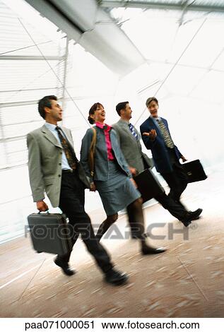 Group of business people walking together indoors, blurred. View Large Photo Image Stock Image - Group of business people walking together indoors, blurred.. Fotosearch