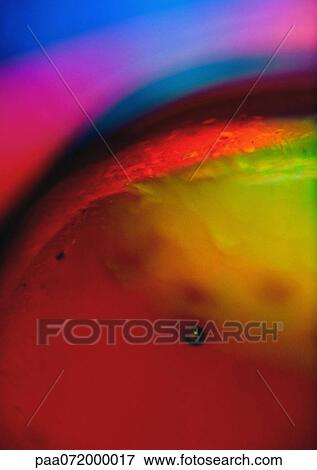 Stock Illustration - Light effect, reds, yellows and blues.. Fotosearch