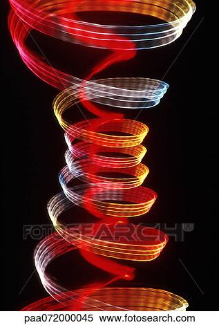 Stock Illustration - Spiraling light effects, one within the other, reds and yellows.. Fotosearch