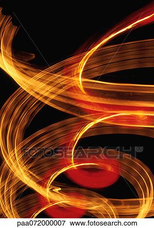 Stock Illustration - Swirling light effect, yellows and reds.. Fotosearch