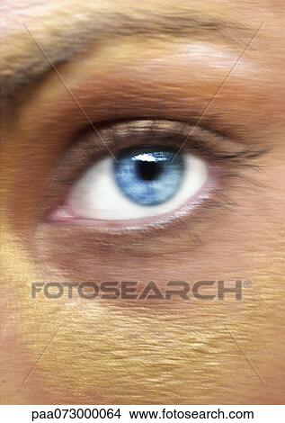 Picture - Woman's blue eye, blurred close up.. Fotosearch