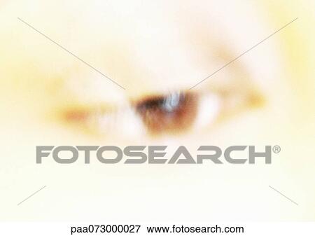 Stock Photo - Woman's brown eye, blurred close up.. Fotosearch