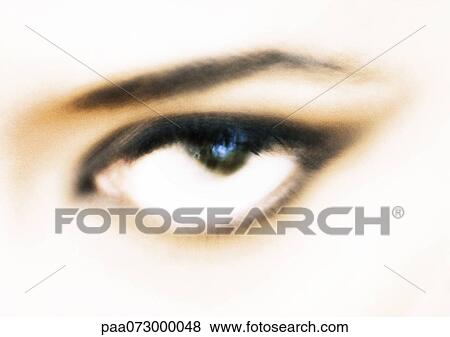 Stock Photo - Woman's eye, blurred close up.. Fotosearch