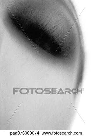 Woman's eyelashes, low angle view, black and white View Large Photo Image Picture - Woman's eyelashes, low angle view, black and white. Fotosearch