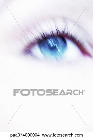 Picture - Woman's blue eye, close-up, blurry.. Fotosearch