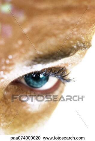 Stock Image - Woman's blue eye, close-up. Fotosearch