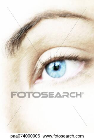 Stock Photograph - Woman's blue eye, extreme close-up, blurred.. Fotosearch