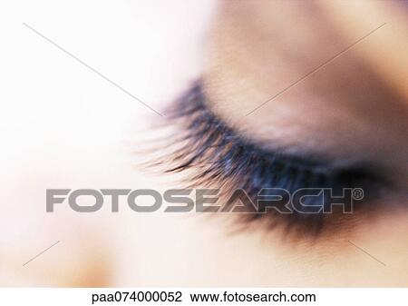 Stock Image - Woman's closed eye, extreme close-up. Fotosearch