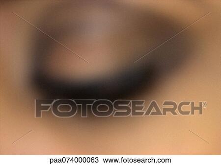 Stock Image - Woman's closed eye, extreme close-up, blurry.. Fotosearch