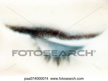 Picture - Woman's closed eye with blue eye shadow, close-up, high angle view, blurry.. Fotosearch