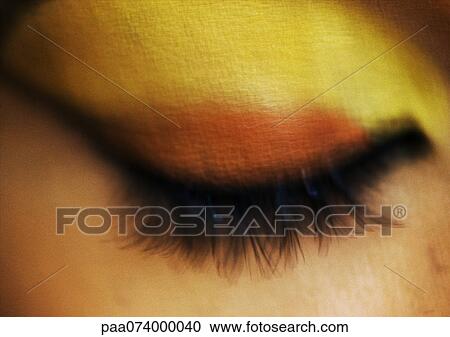 Woman's eye closed with yellow and orange eye shadow, extreme close-up, blurred View Large Photo Image Stock Image - Woman's eye closed with yellow and orange eye shadow, extreme close-up, blurred. Fotosearch