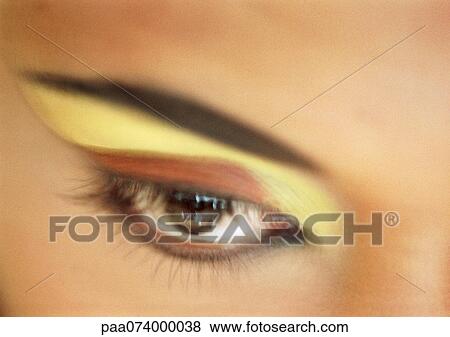 Woman's eye with yellow and orange eye shadow, extreme close-up, blurred. View Large Photo Image Stock Photo - Woman's eye with yellow and orange eye shadow, extreme close-up, blurred.. Fotosearch