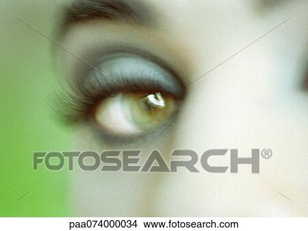 Woman's made-up eye, close-up, blurry. View Large Photo Image Picture - Woman's made-up eye, close-up, blurry.. Fotosearch