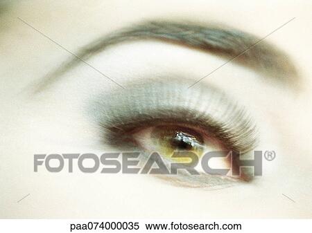 Stock Photography - Woman's made-up eye, close-up, blurry.. Fotosearch