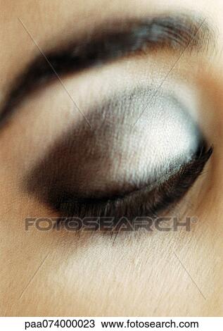 Woman's made-up, lowered eye, close-up View Large Photo Image Stock Image - Woman's made-up, lowered eye, close-up. Fotosearch