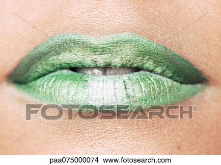 Picture - Woman wearing green lipstick, close up of mouth.. Fotosearch