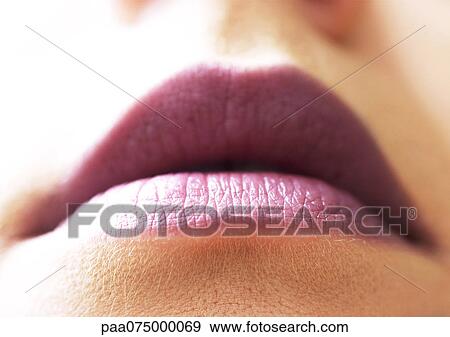 Woman wearing lipstick, close up of mouth, low angle view View Large Photo Image Stock Photo - Woman wearing lipstick, close up of mouth, low angle view. Fotosearch