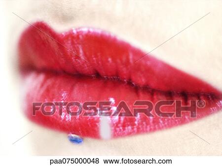 Woman wearing red lipstick, close up of mouth with jewel adornment. View Large Photo Image Stock Photo - Woman wearing red lipstick, close up of mouth with jewel adornment.. Fotosearch