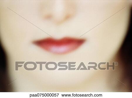 Woman wearing red lipstick, close up of lower face, blurred. View Large Photo Image Stock Photo - Woman wearing red lipstick, close up of lower face, blurred.. Fotosearch